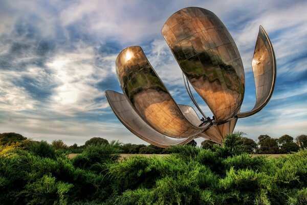 Unidentified object against the sky and waving grass