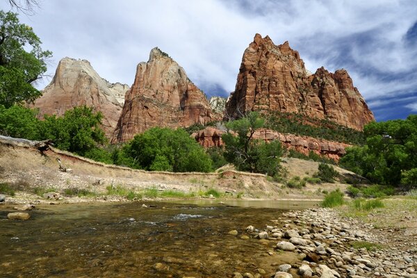 Red rocks above a mountain river