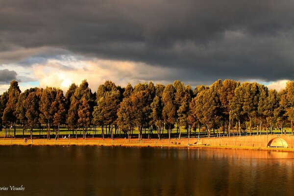 A tent on the lake shore on a gloomy autumn day