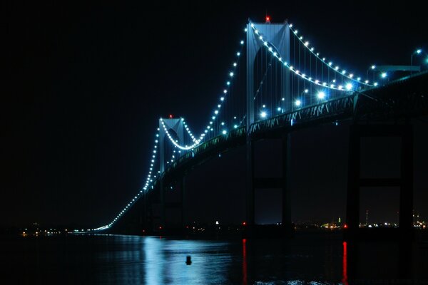 A bridge illuminated by garlands of lanterns