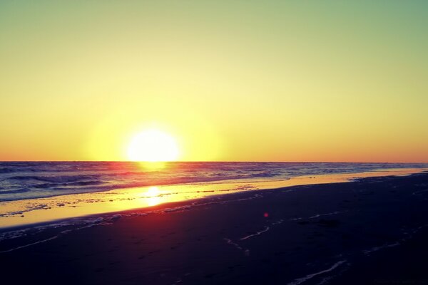 Dawn over the calm waters of the ocean