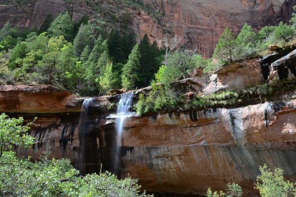 Water from the waterfall falls into the gorge