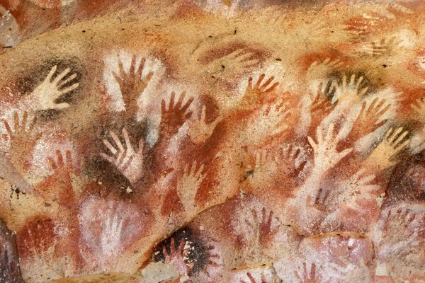 Hand prints on the rock in close-up