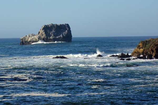 Rough sea and rocks During the Day