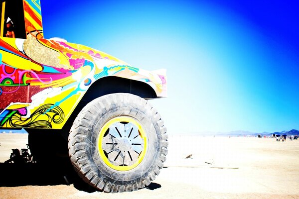 Beach colored SUV on the sand