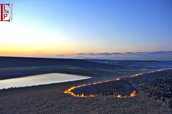 Fire, field, sunset and river