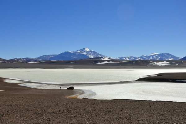 The frozen river flows straight into the sky