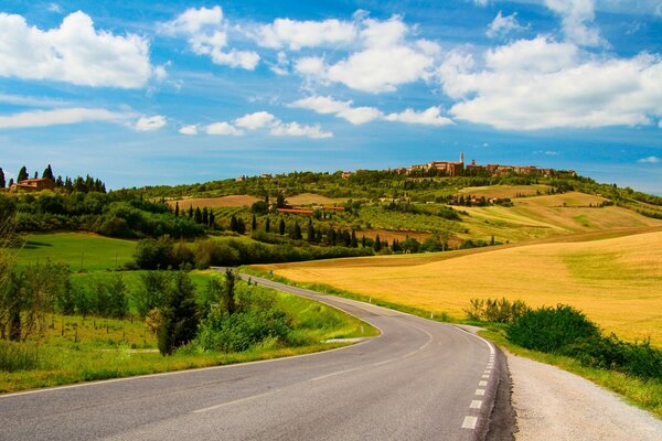 A road in the countryside among the golden hills