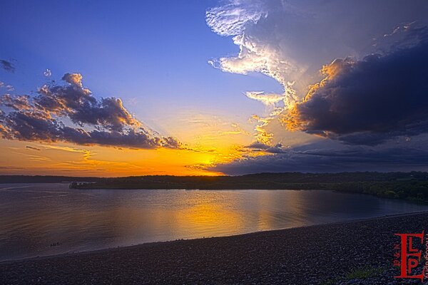 Beautiful sunset on the background of mountains and the sea