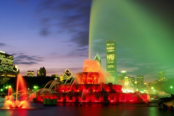 Fountain with illumination. Evening City