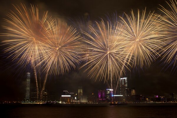 Fireworks festival in Asia over skyscrapers