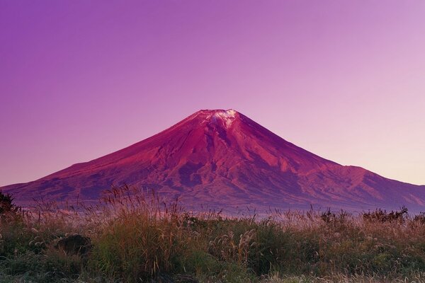 Volcano in the mountains at sunset