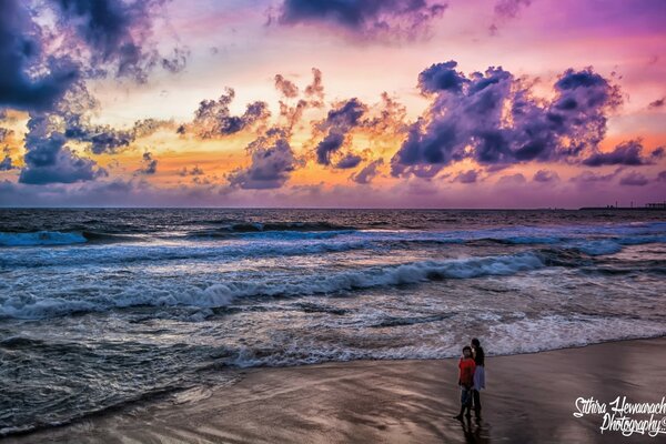 Bright sky with clouds over raging waves