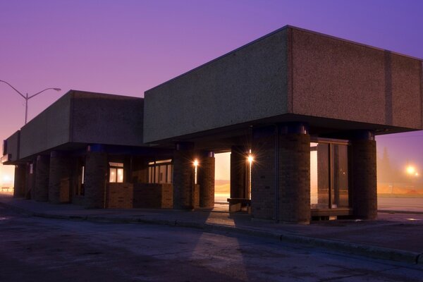 A house with strange architecture against a purple sky