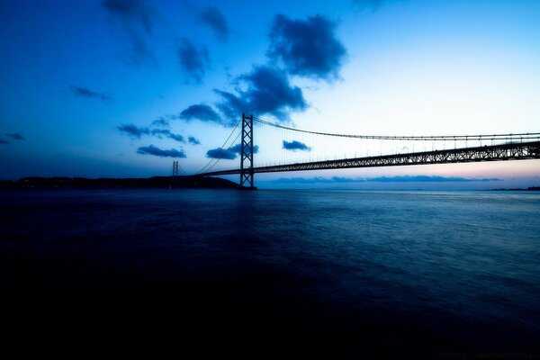 A long bridge at nightfall