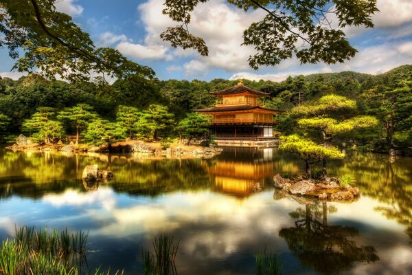 The Asian temple is reflected in the lake