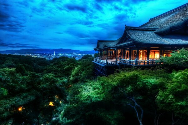 House on the edge of the mountain at night