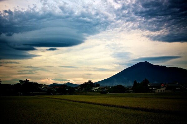 SKY OVER THE MOUNTAIN, VILLAGE UNDER THE MOUNTAIN