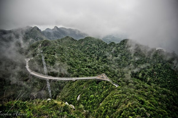 The mountain road winds down the slope