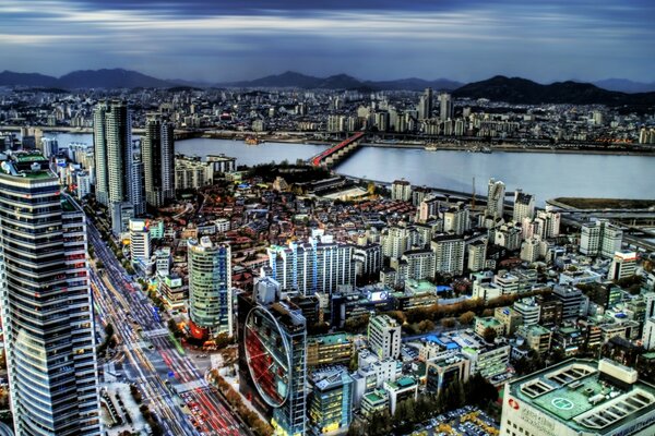 View of the daytime city on the background of mountains