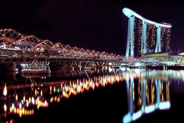 Illuminated bridge at night