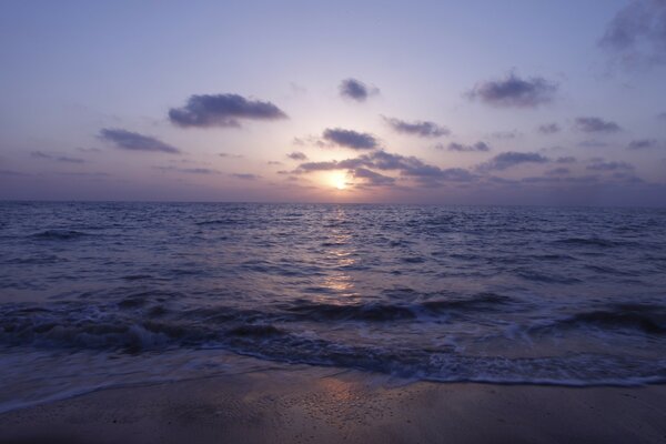 Twilight sunset on the beach against the sky