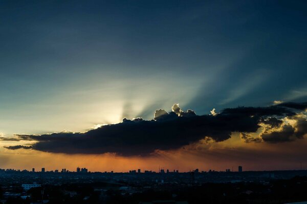 The sun through the clouds at sunset