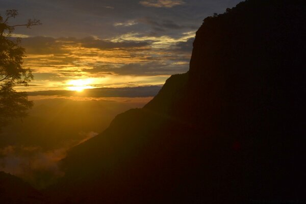 Sunset landscape on the background of mountains