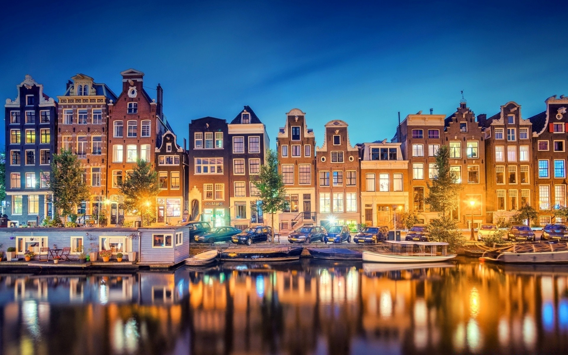 europe architecture city travel dusk building evening town outdoors illuminated house water river sky sight cityscape tourism reflection urban horizontal