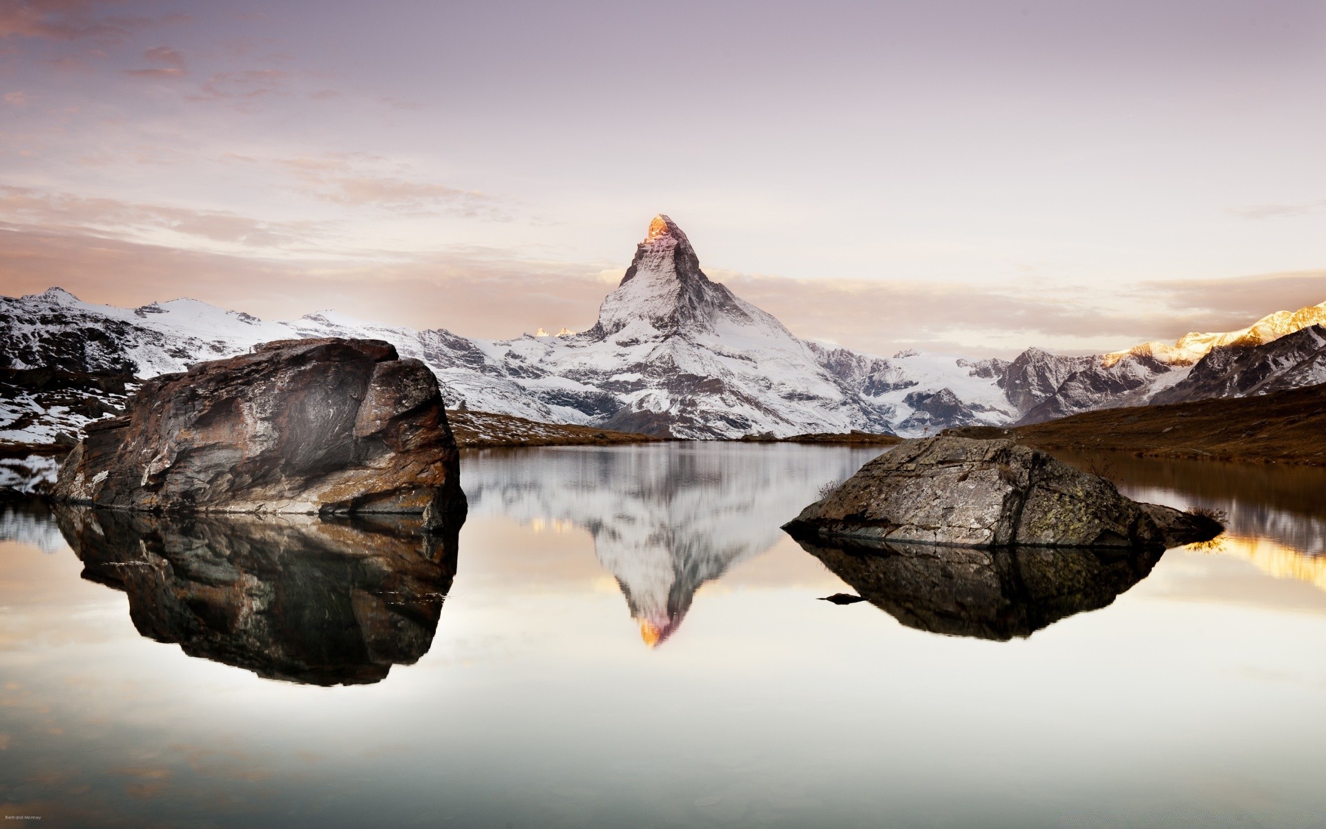 europe nature snow landscape water mountain ice cold rock sky travel winter dawn reflection