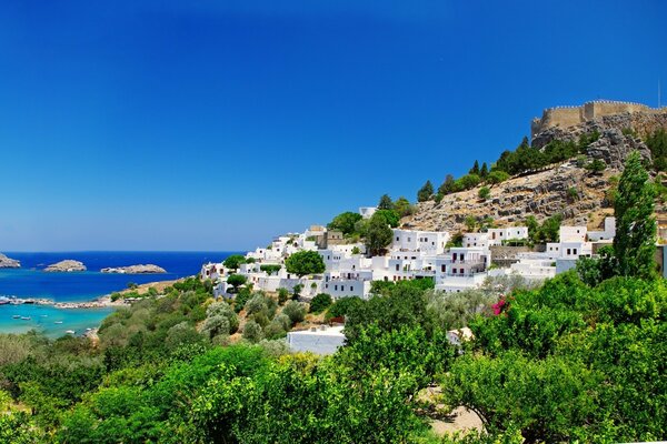 Architectural structures on the mountainside near the sea