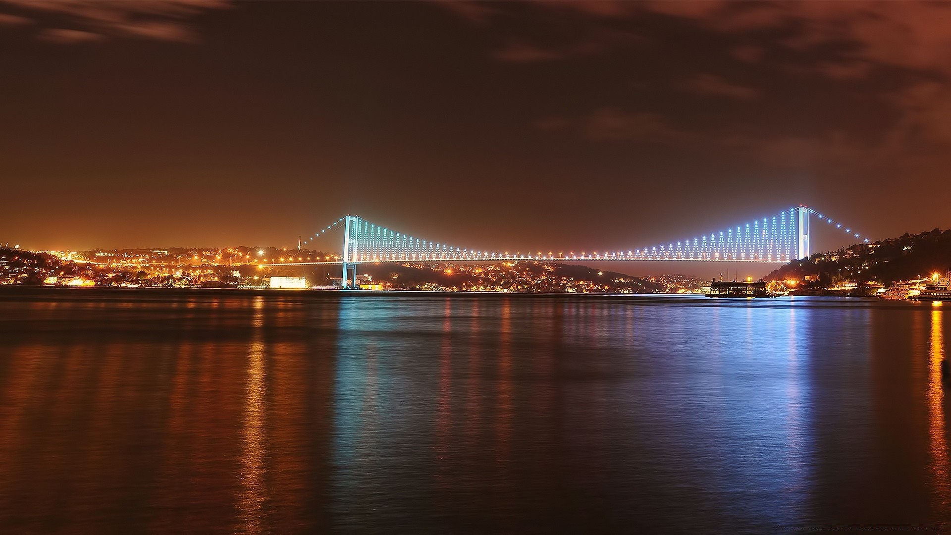 europe sunset water bridge dusk architecture evening travel sky dawn city suspension bridge river downtown reflection cityscape connection outdoors