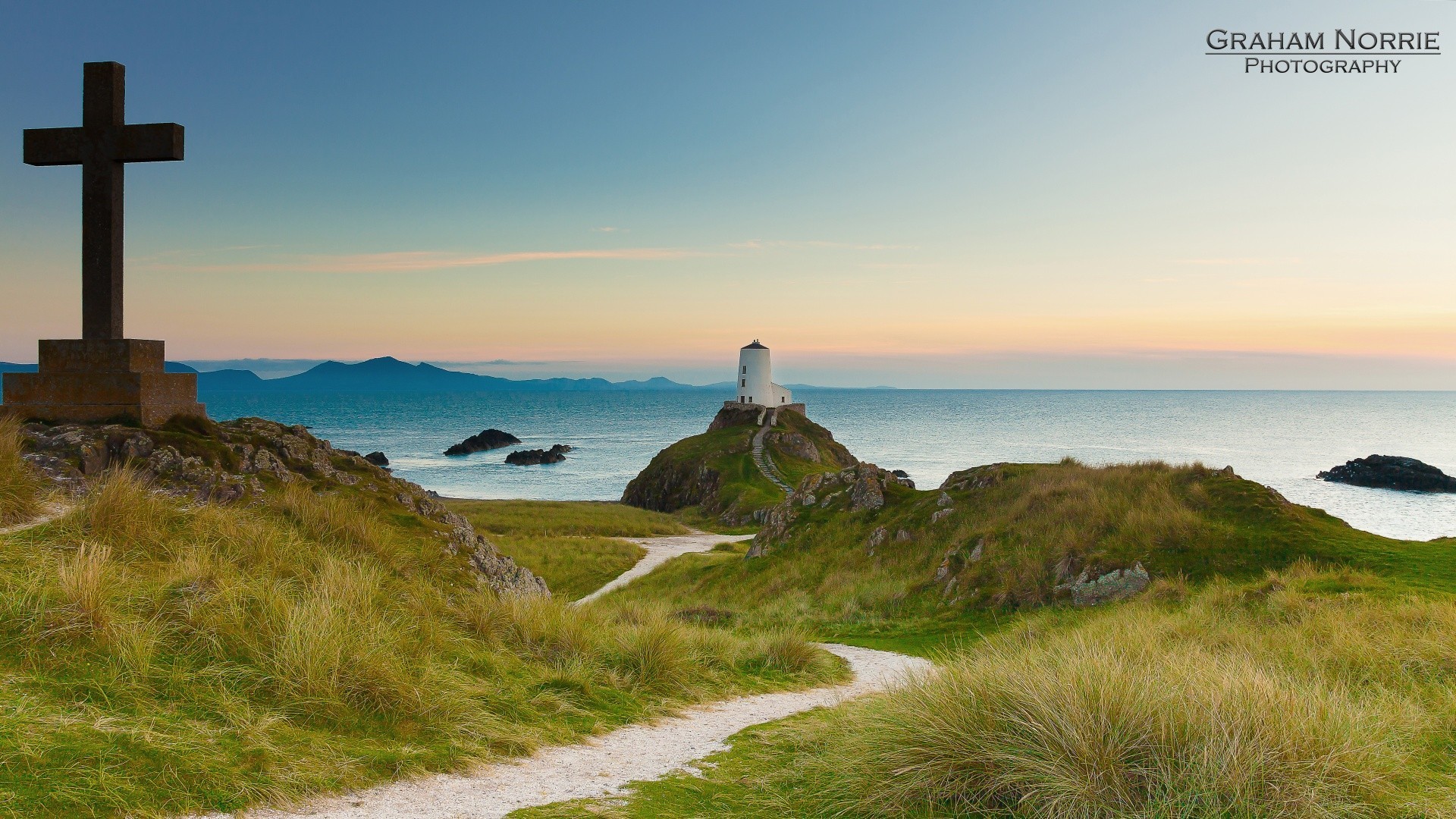 europe lighthouse seashore water sea outdoors travel landscape sky beach ocean guidance grass nature sunset daylight rock