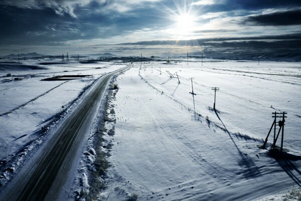 Winter evening road into the distance