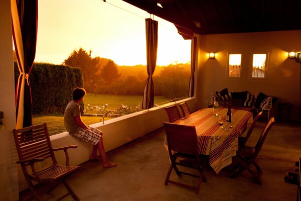 Veranda with table and wooden chairs