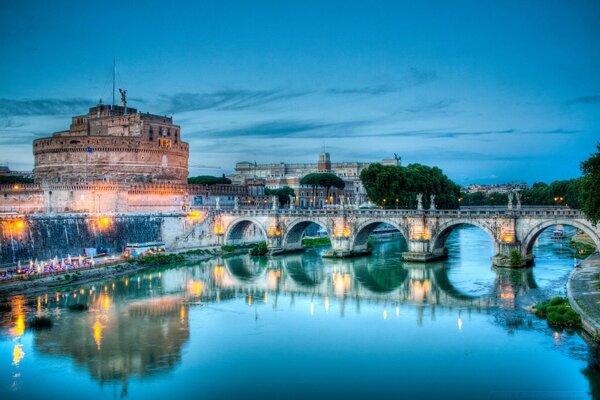 The ancient bridge of the city with glowing lights