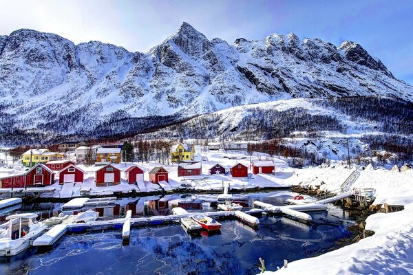 Winter landscape with houses near the mountains