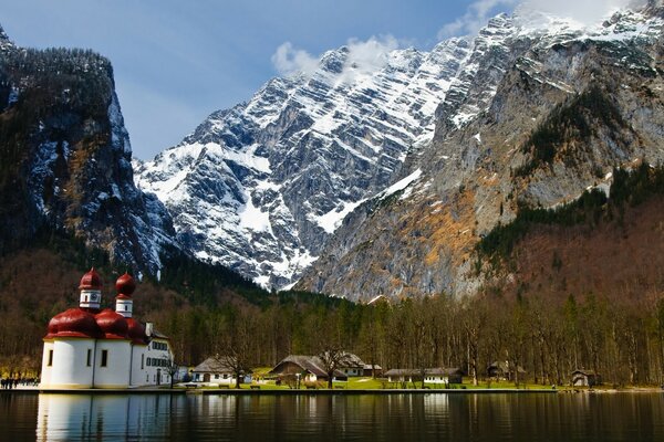 Temple at the foot of the mountain, Alpine lake