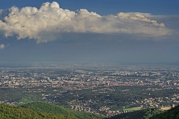 The city looks miniature to a toy from a bird s-eye view