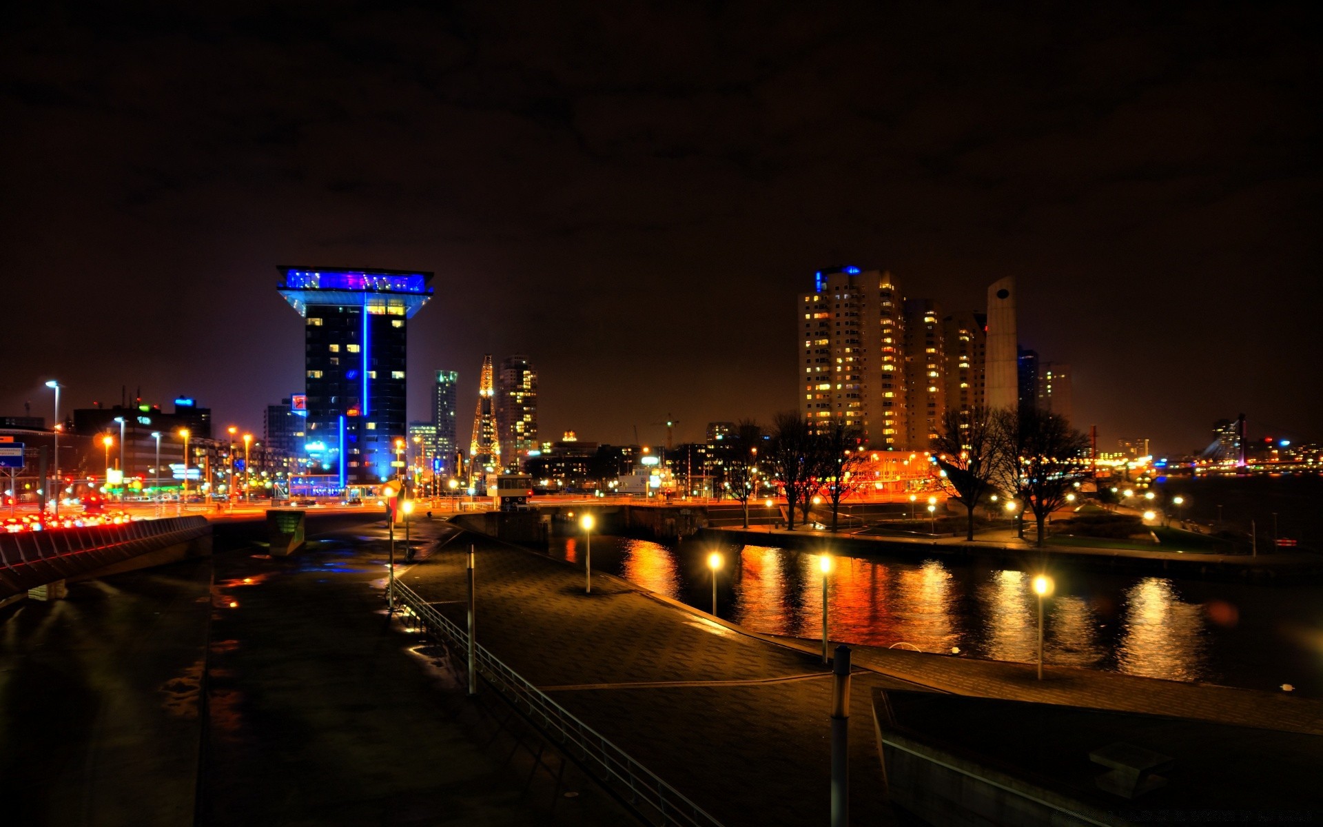 europe city dusk evening downtown cityscape river skyline architecture bridge water skyscraper travel sunset building business traffic sky urban light harbor