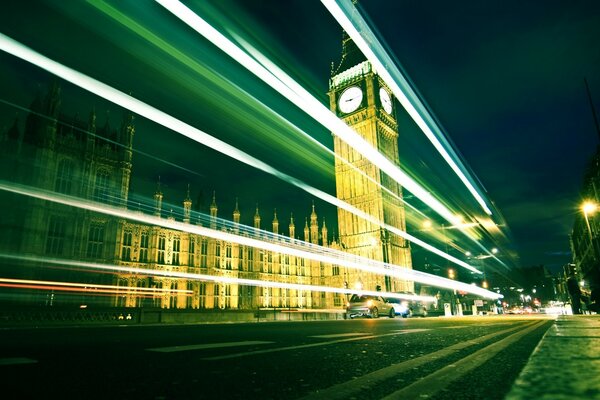 The urban landscape is blurred by fast traffic