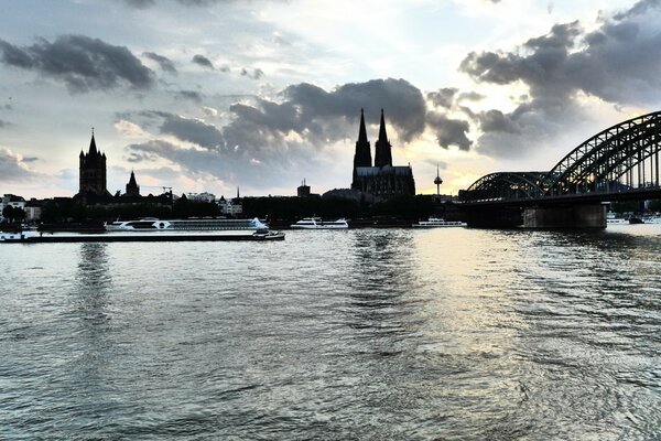 A city with a view of the river and a beautiful bridge