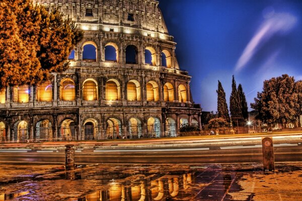 Illuminated Colosseum at dusk