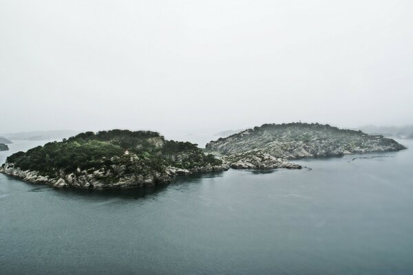 European islands, washed by the sea and covered with fog