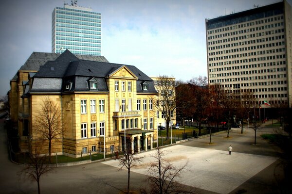 Contrast of houses of different styles of architecture in the city