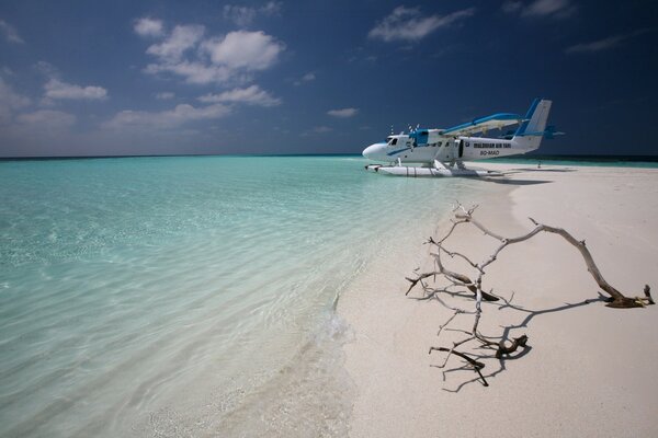 An island by the ocean with white sand landscape