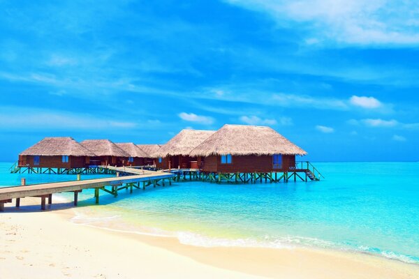 Wooden bridge to the houses on the water