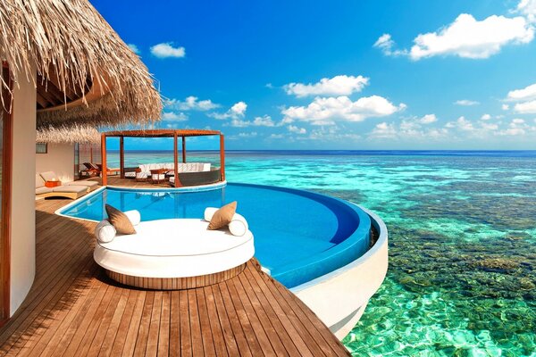 Bungalow and pool with reef view