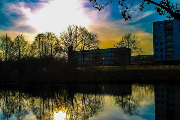 The urban landscape is displayed in the water