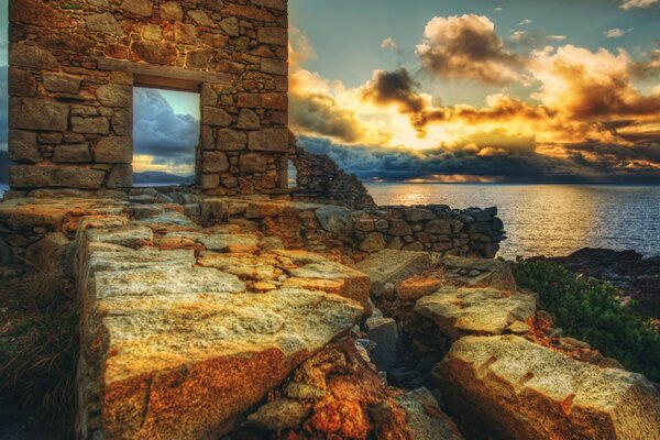 Ruins on the seashore during sunset